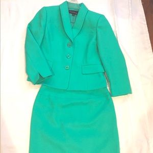 It’s a Skirt Suit size 6p. It’s textured. %100 polyester with a lining.